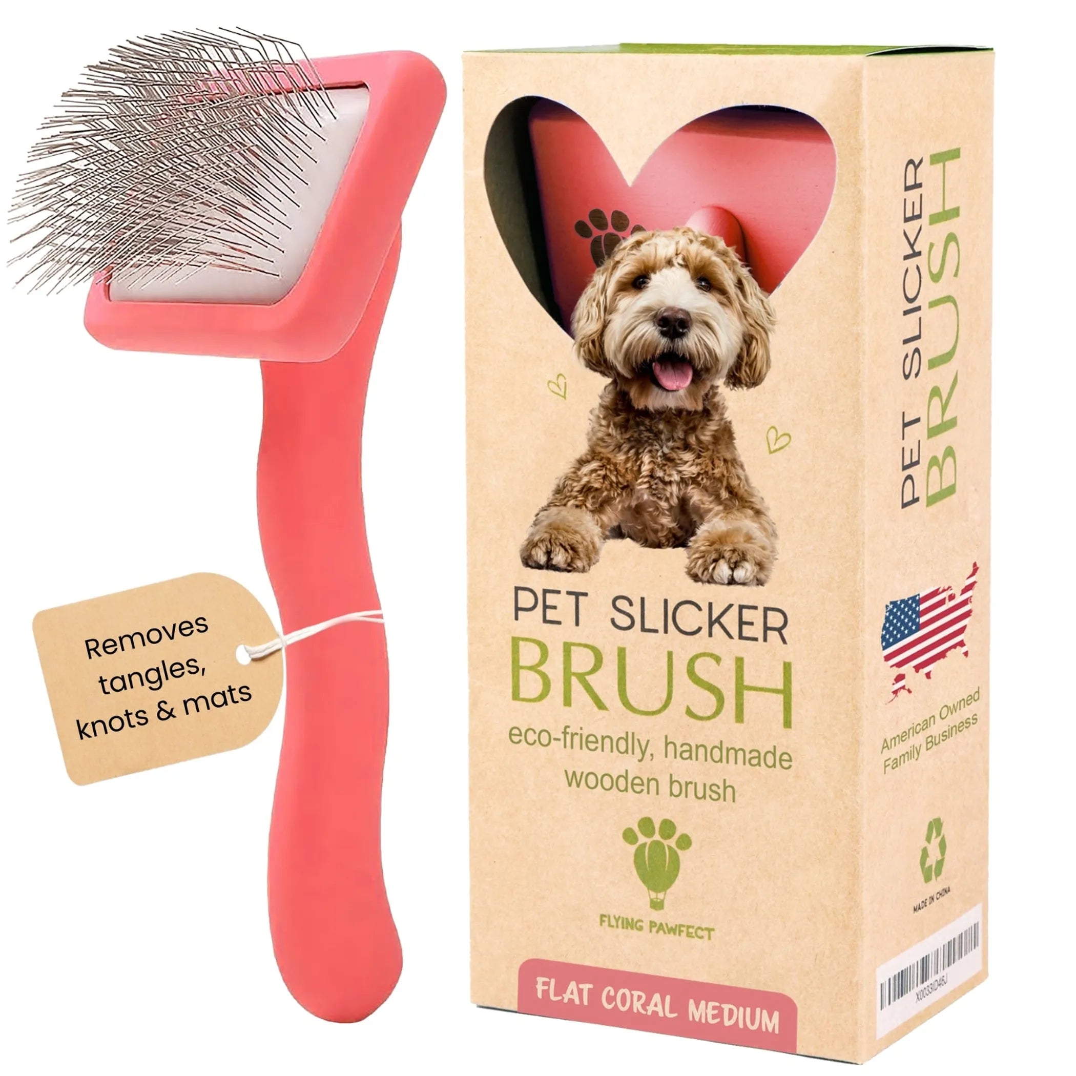 Pink pet slicker brush with a cardboard box featuring a dog and product details.