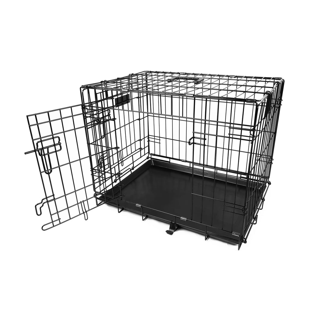 Black metal dog crate with open door on a white background