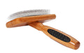 Wooden pet grooming brush with bristle head on a white background