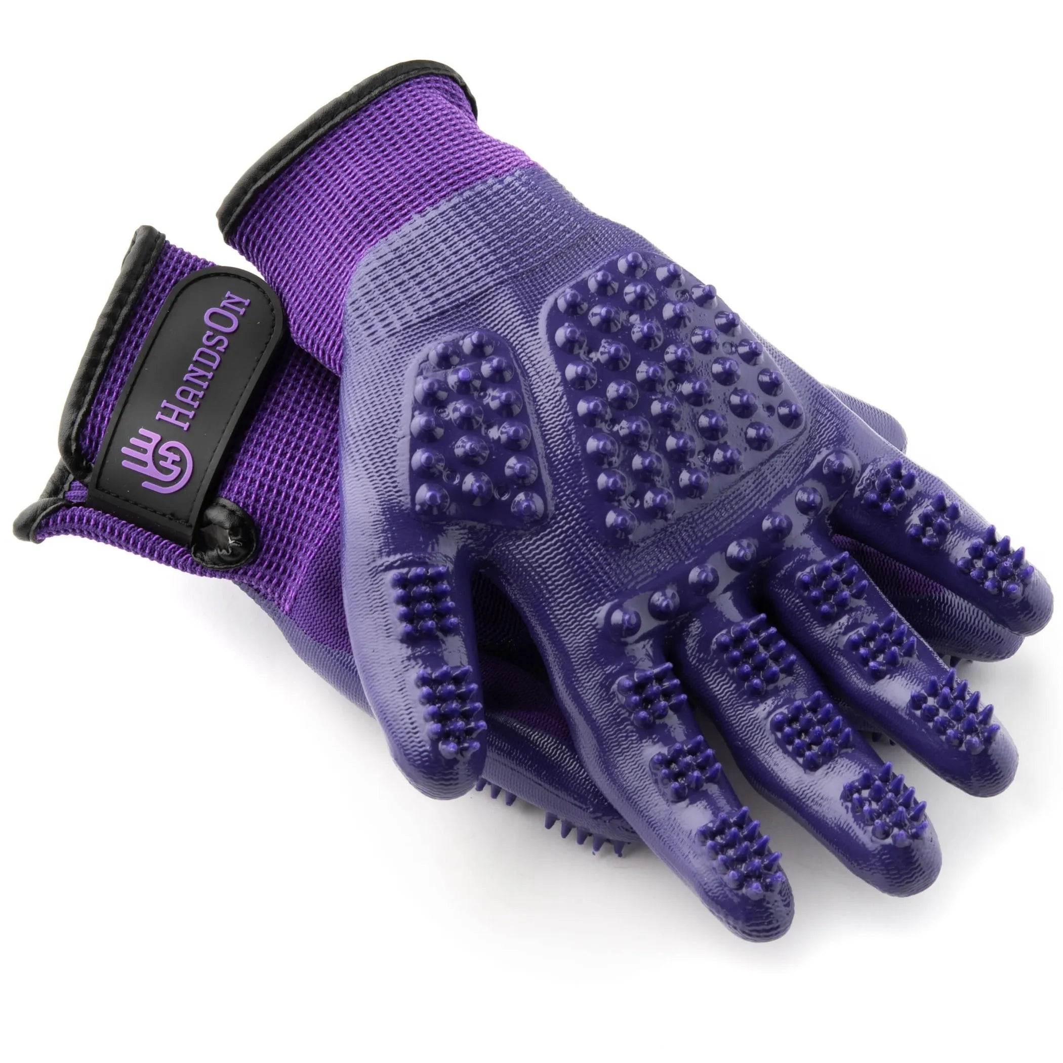 Purple grooming glove with textured surface on a white background