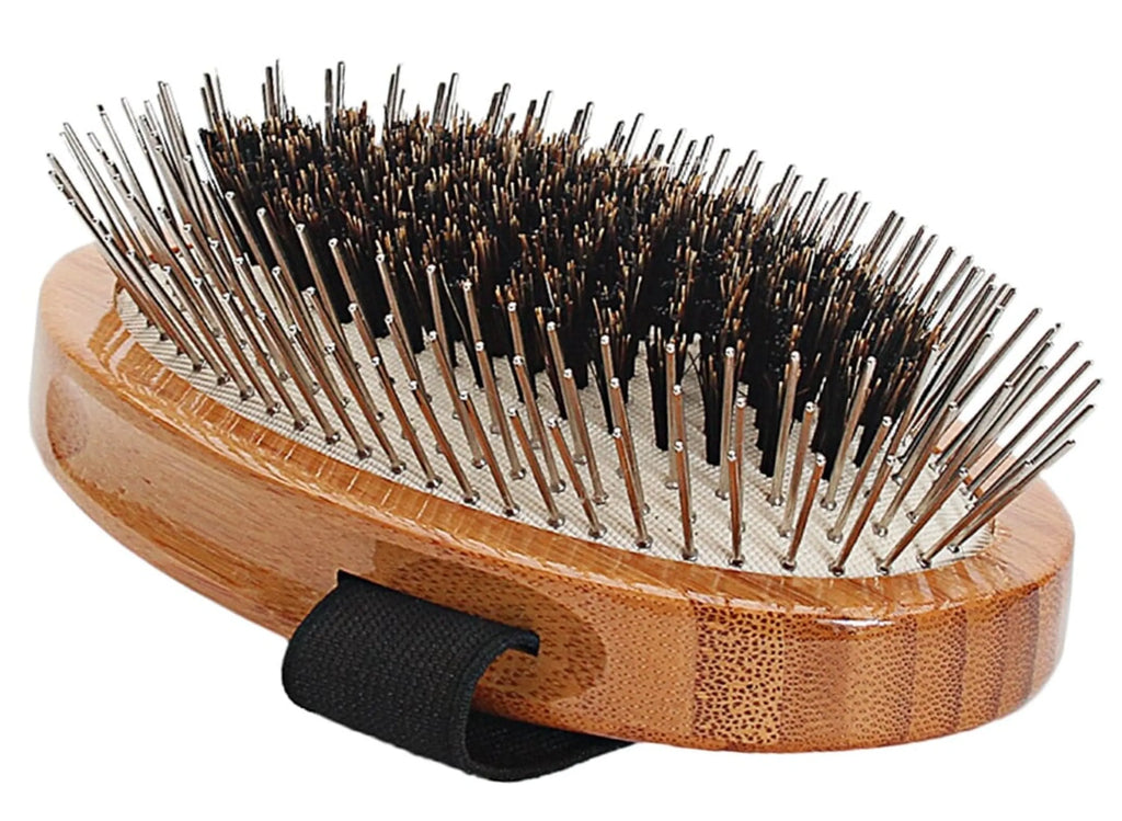 Wooden hairbrush with bristles on a white background