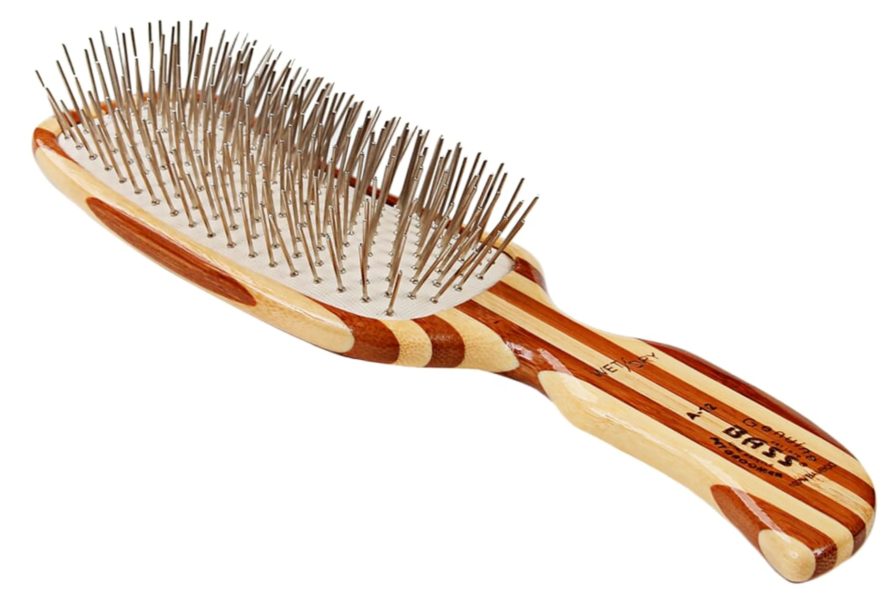 Wooden hairbrush with bristles on a white background