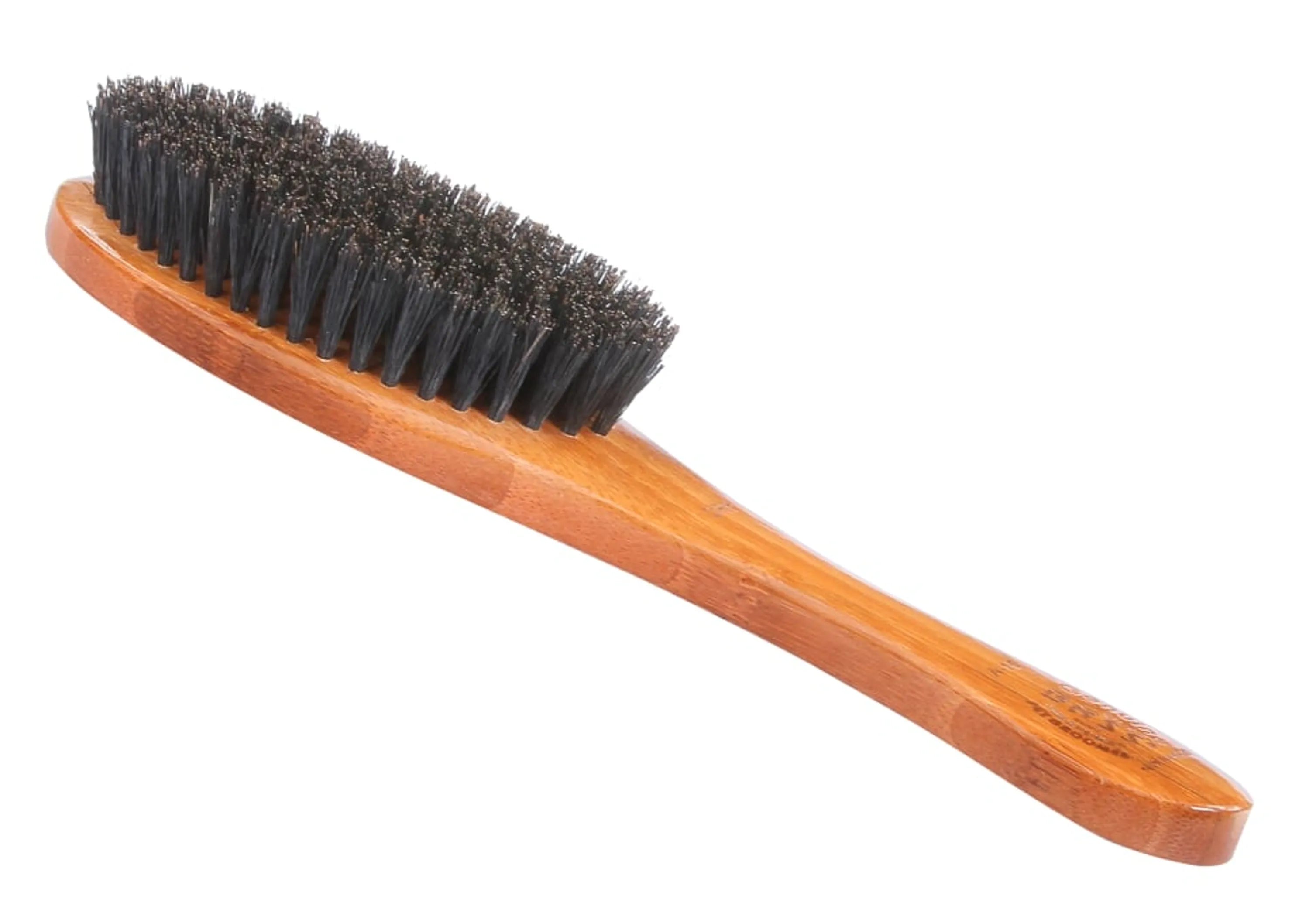 Wooden brush with black bristles on a white background