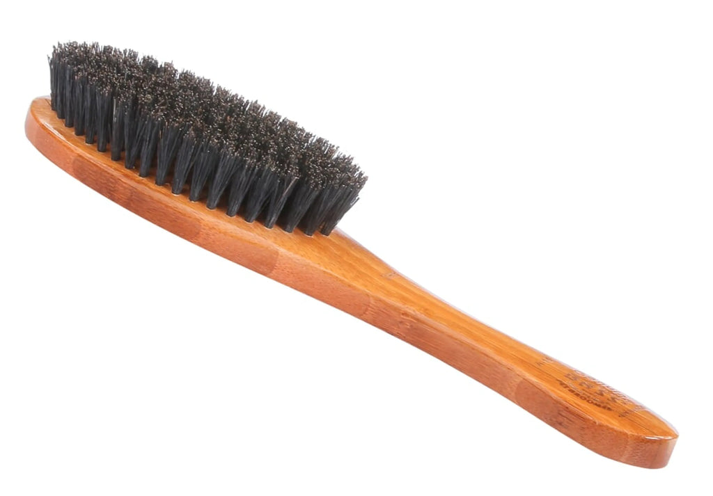 Wooden brush with black bristles on a white background