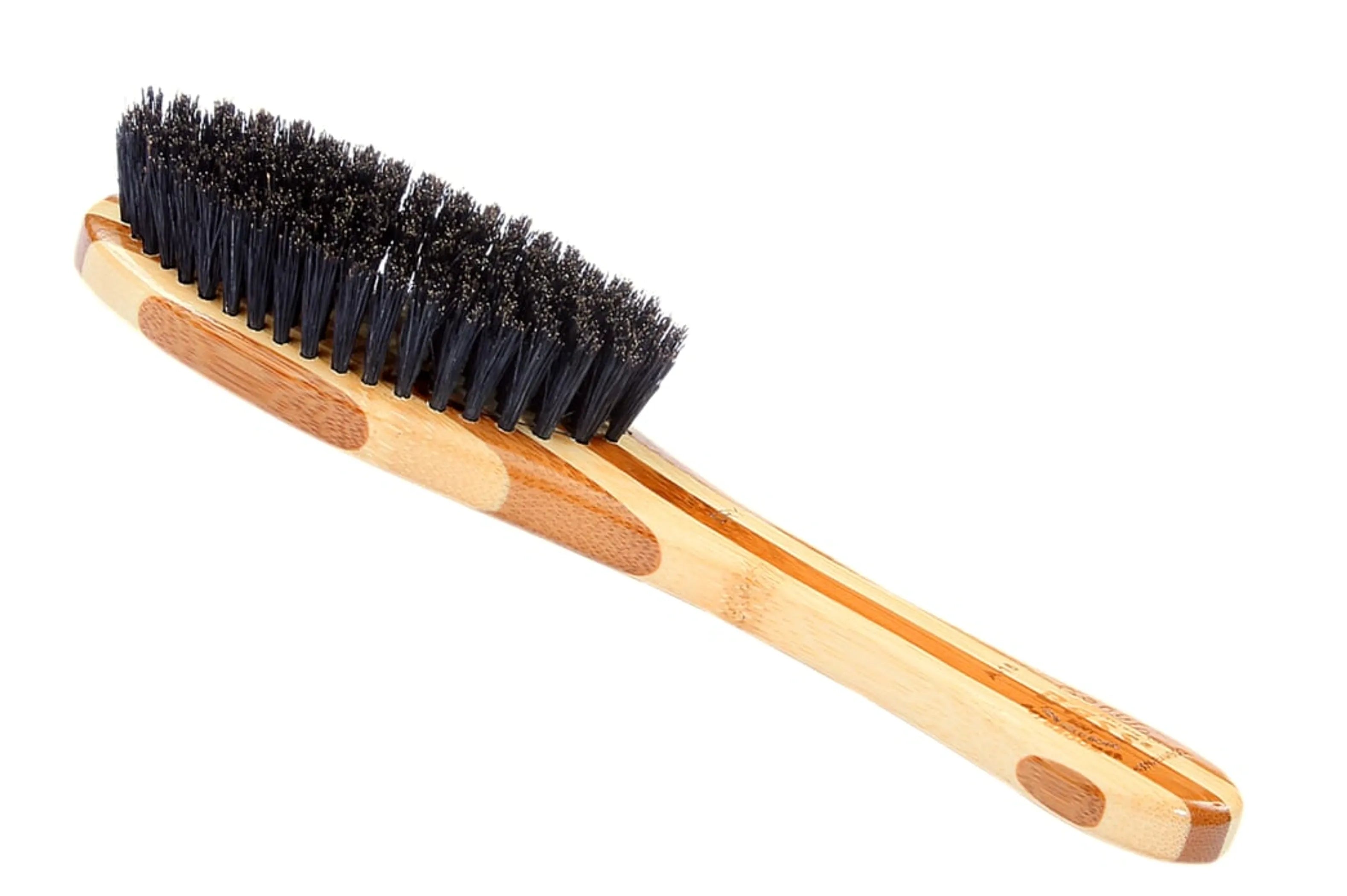 Wooden brush with black bristles on a white background