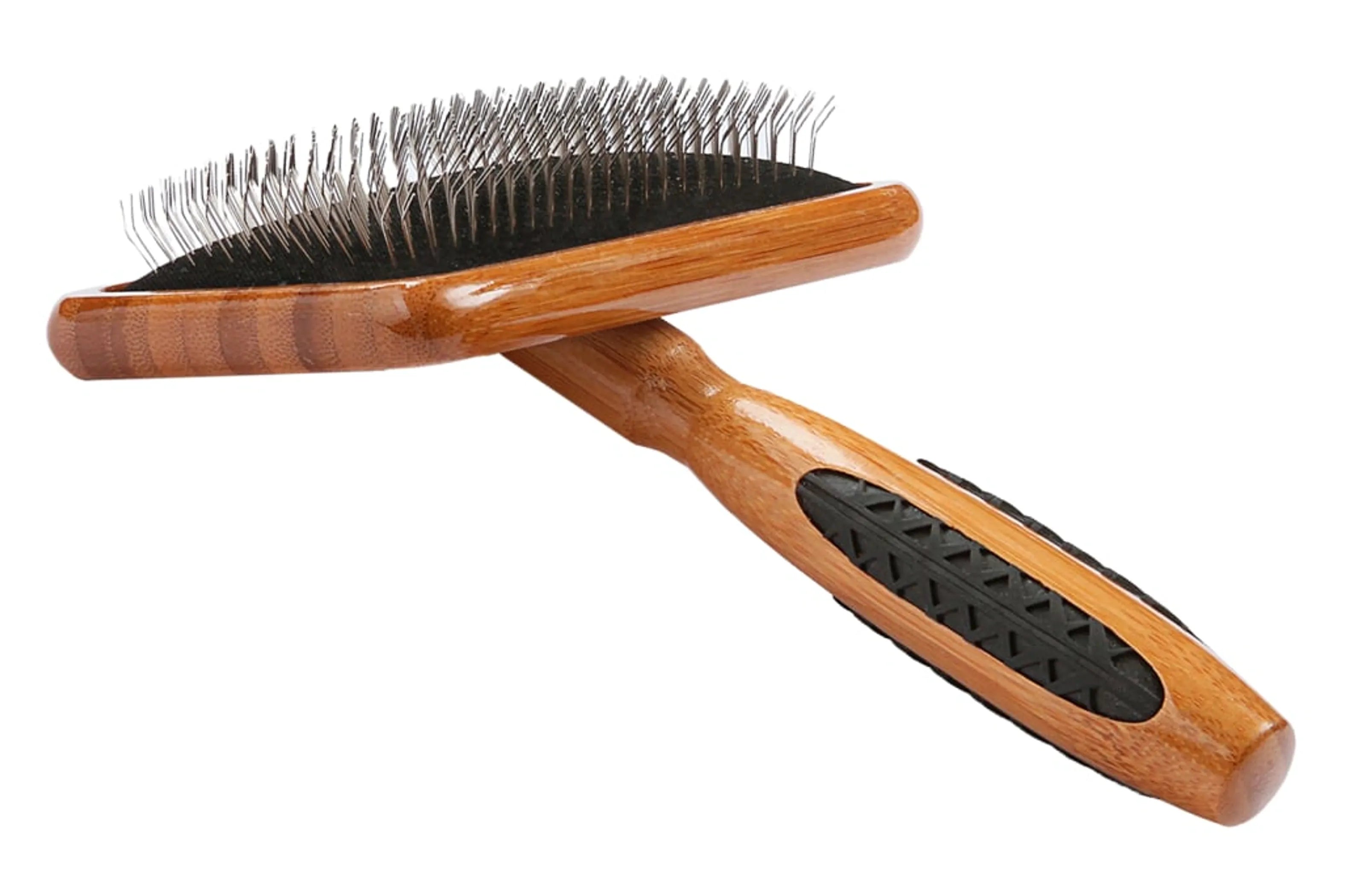 Wooden hairbrush with black bristles on a white background