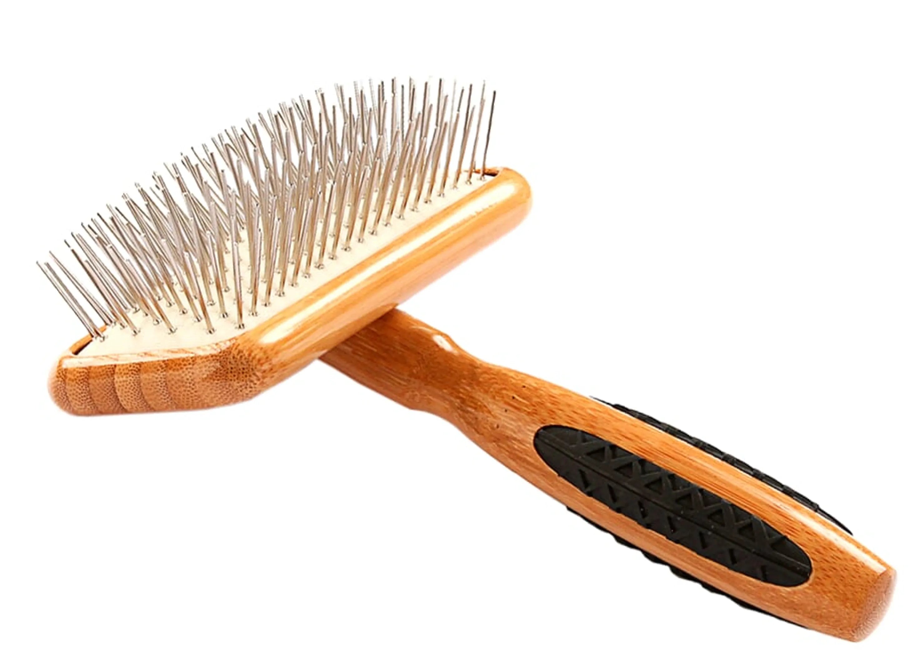 Wooden pet grooming brush with metal pins on a white background